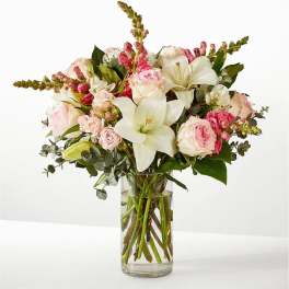 Pink and white mixed bouquet in a clear glass vase