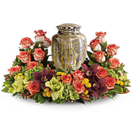 Rose arrangement surrounding an ornate metal urn