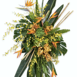 Tall tropical floral spray with orange bird-of-paradise and yellow orchids