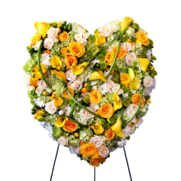 Heart-shaped floral spray with yellow calla lilies and roses