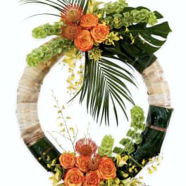 Tropical floral wreath with orange roses and green foliage