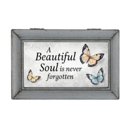 Framed memorial sign with butterflies and the words "A Beautiful Soul is never forgotten"