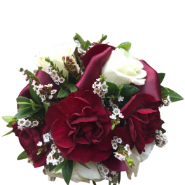 Bouquet of red and white roses with small white filler flowers