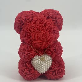 Red rose teddy bear with a pearl heart pendant