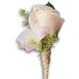 Small pale pink and white boutonniere with a wrapped stem