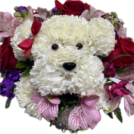 White flower dog arrangement with a red bow and pink accents