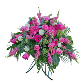 Large pink floral spray with roses and white blooms