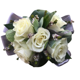 Bouquet of white roses with small filler flowers and lavender wrapping