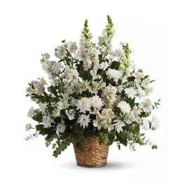 White floral arrangement in a woven basket