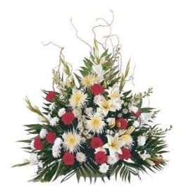 Large floral arrangement with red, white, and yellow flowers