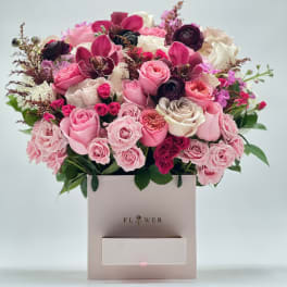 Pink and white rose bouquet in a square gift box