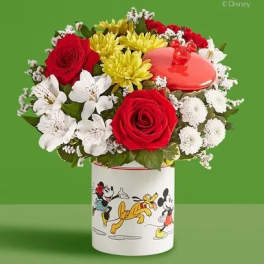 Red roses and white flowers in a Mickey Mouse tin container
