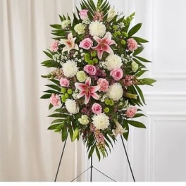 Standing floral spray with pink and white flowers on an easel