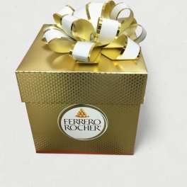 Gold Ferrero Rocher gift box with a white and gold ribbon bow