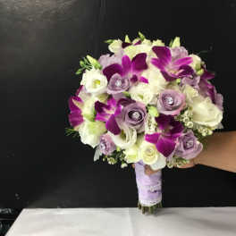 Purple and white bridal bouquet with roses and orchids