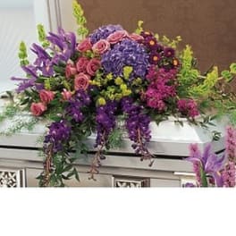 Large purple and pink floral casket spray