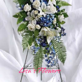Blue and white floral standing spray on an easel