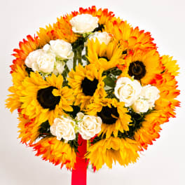 Bouquet of yellow sunflowers and white roses with a red ribbon