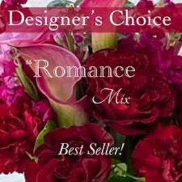 Red and pink floral arrangement with calla lilies and roses