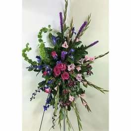 Tall floral spray with pink roses and purple blooms