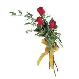 Three red roses tied with a yellow ribbon
