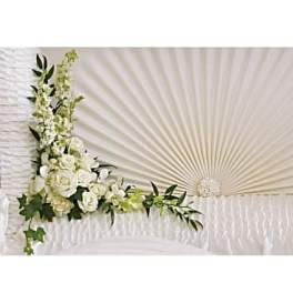 White floral spray arranged in a fan shape with greenery