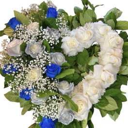Heart-shaped bouquet of white, silver, and blue roses with baby's breath