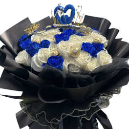 Bouquet of blue and white roses wrapped in black paper