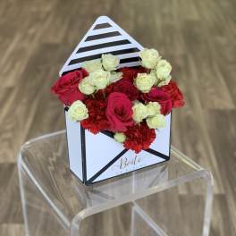 Small box arrangement of red and white roses with carnations