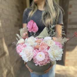 Large pink and white bouquet in a round box