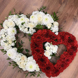 Heart-shaped floral arrangements in red and white roses with white mums
