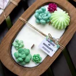 Wooden tray with assorted succulent-shaped soaps or candles