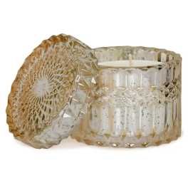 Two textured glass candle holders with white candles inside