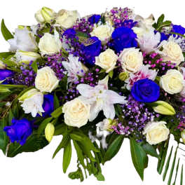 Bouquet of white and vivid blue roses with purple filler flowers
