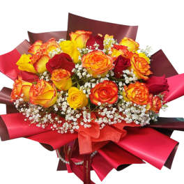 Bouquet of red and yellow roses with white baby's breath in red wrap