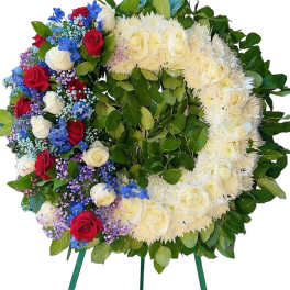 Heart-shaped floral wreath with red, white, blue, and purple flowers