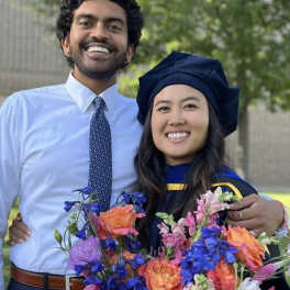 Graduation bouquet of orange, pink, and blue flowers