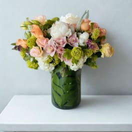 Mixed pastel bouquet in a glass vase