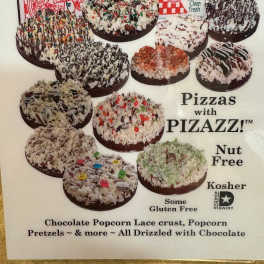 Poster showing assorted chocolate-drizzled popcorn pizzas in pizza boxes