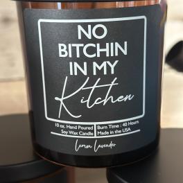 Black soy candle jar with a bold profanity label