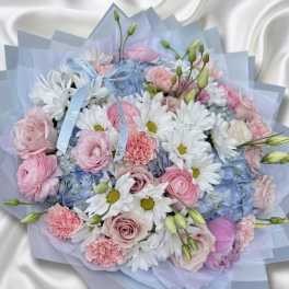Pastel bouquet of pink and white flowers with blue wrapping