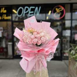 Pink rose bouquet wrapped in layered pink paper