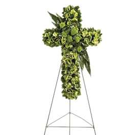Green floral cross on a metal easel
