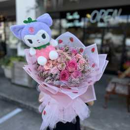 Pink rose bouquet with a purple plush character topper