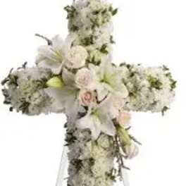White floral cross on a stand