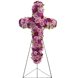 Cross-shaped floral standing spray in pink and purple tones