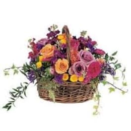 Mixed flower basket with roses and purple blooms