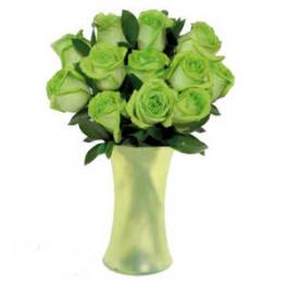 Green roses in a tall glass vase