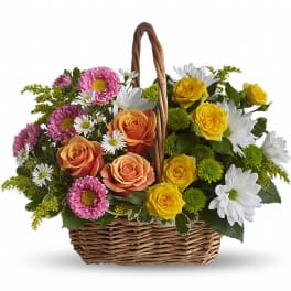 Basket of pink, orange, yellow, and white flowers