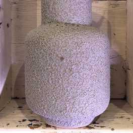 Textured ceramic vase with a rounded body and narrow neck